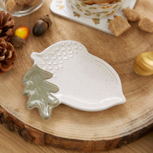 Cartco Cooksmart Forest Fable ceramic tea bag tidy shaped like a speckled acorn with a sage green oak leaf detail.