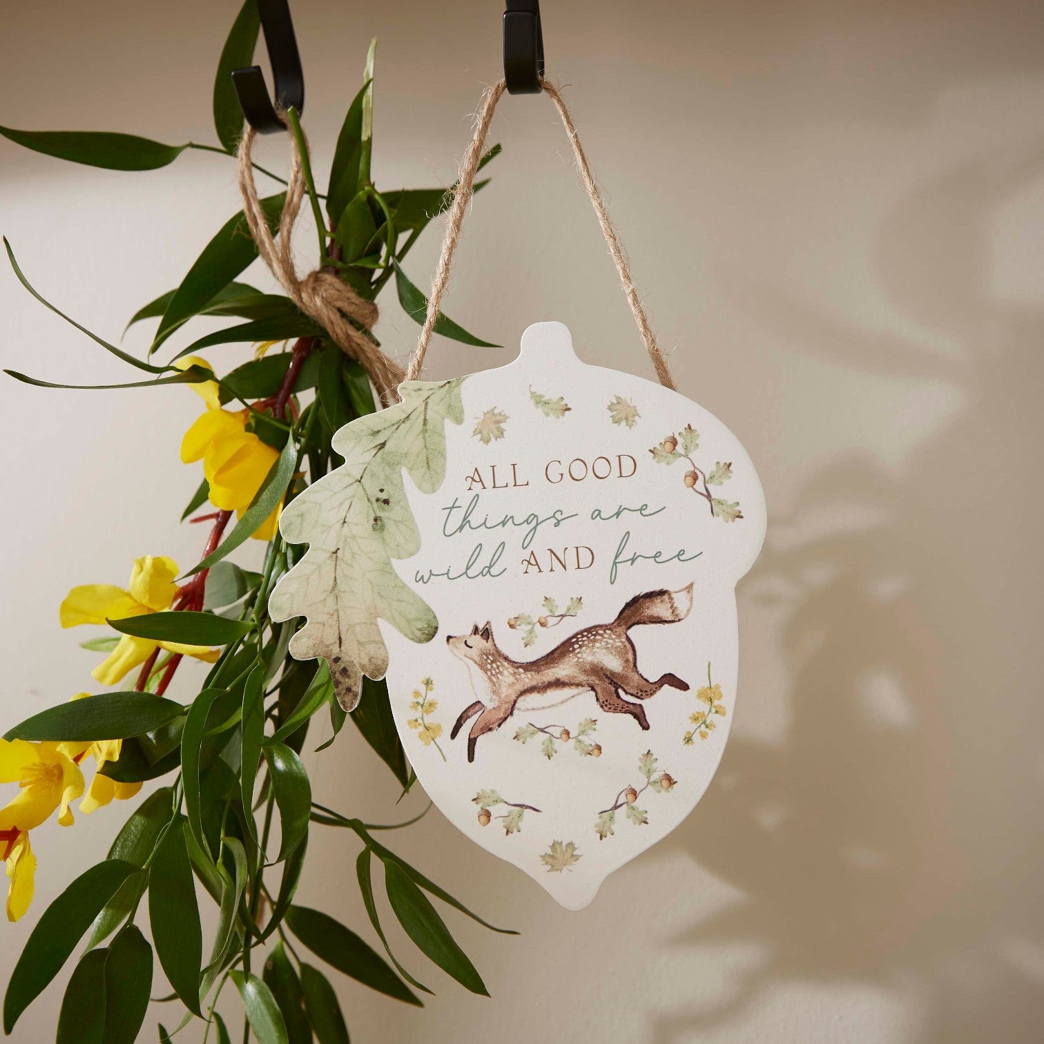 Cartco Cooksmart Forest Fable acorn-shaped hanging plaque featuring a fox and the quote All Good Things Are Wild And Free