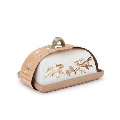 Cartco Cooksmart Forest Fable ceramic butter dish with hare and fox illustrations and a sage green loop handle.