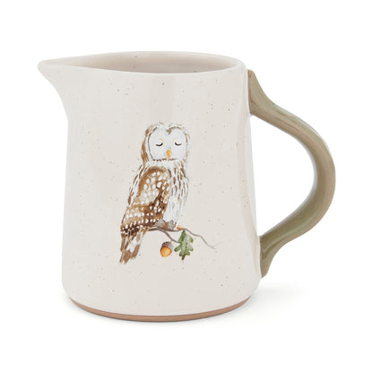 Cartco Cooksmart Forest Fable ceramic jug with a speckled cream glaze, sage green handle, and owl illustration.