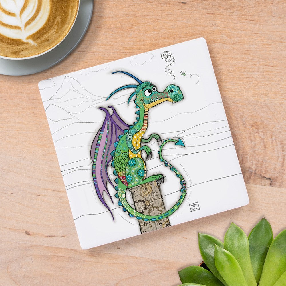 Cartco square ceramic coaster featuring a whimsical green and purple Duncan Dragon illustration on a wooden table.