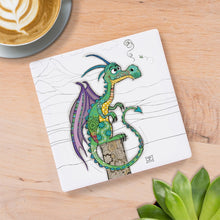 Cartco square ceramic coaster featuring a whimsical green and purple Duncan Dragon illustration on a wooden table.