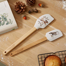 Cartco Cooksmart Forest Fable set of two bamboo spatulas featuring woodland hare and owl illustrations on a wooden table