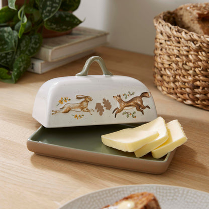 Cartco Cooksmart Forest Fable ceramic butter dish with hare and fox illustration and sage green loop handle