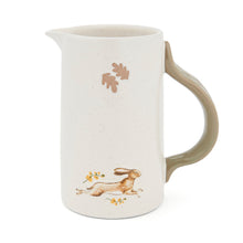Cartco Cooksmart Forest Fable ceramic jug with a speckled cream glaze, sage green handle, and running hare design.