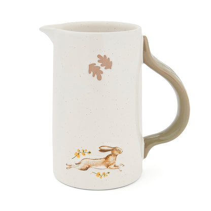 Cartco Cooksmart Forest Fable ceramic jug with a speckled cream glaze, sage green handle, and running hare design.