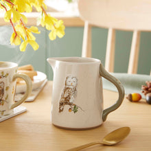 Cartco Cooksmart Forest Fable ceramic jug with owl illustration, speckled cream glaze, and sage green handle on table