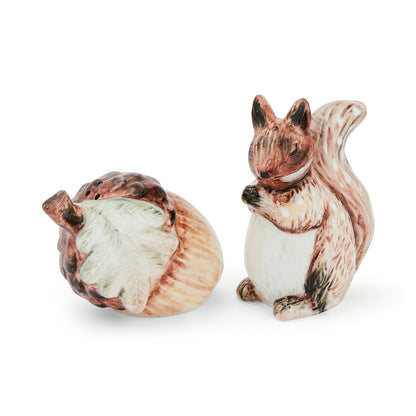 Cartco Cooksmart Forest Fable ceramic salt and pepper shakers featuring a sculpted squirrel and a textured acorn.