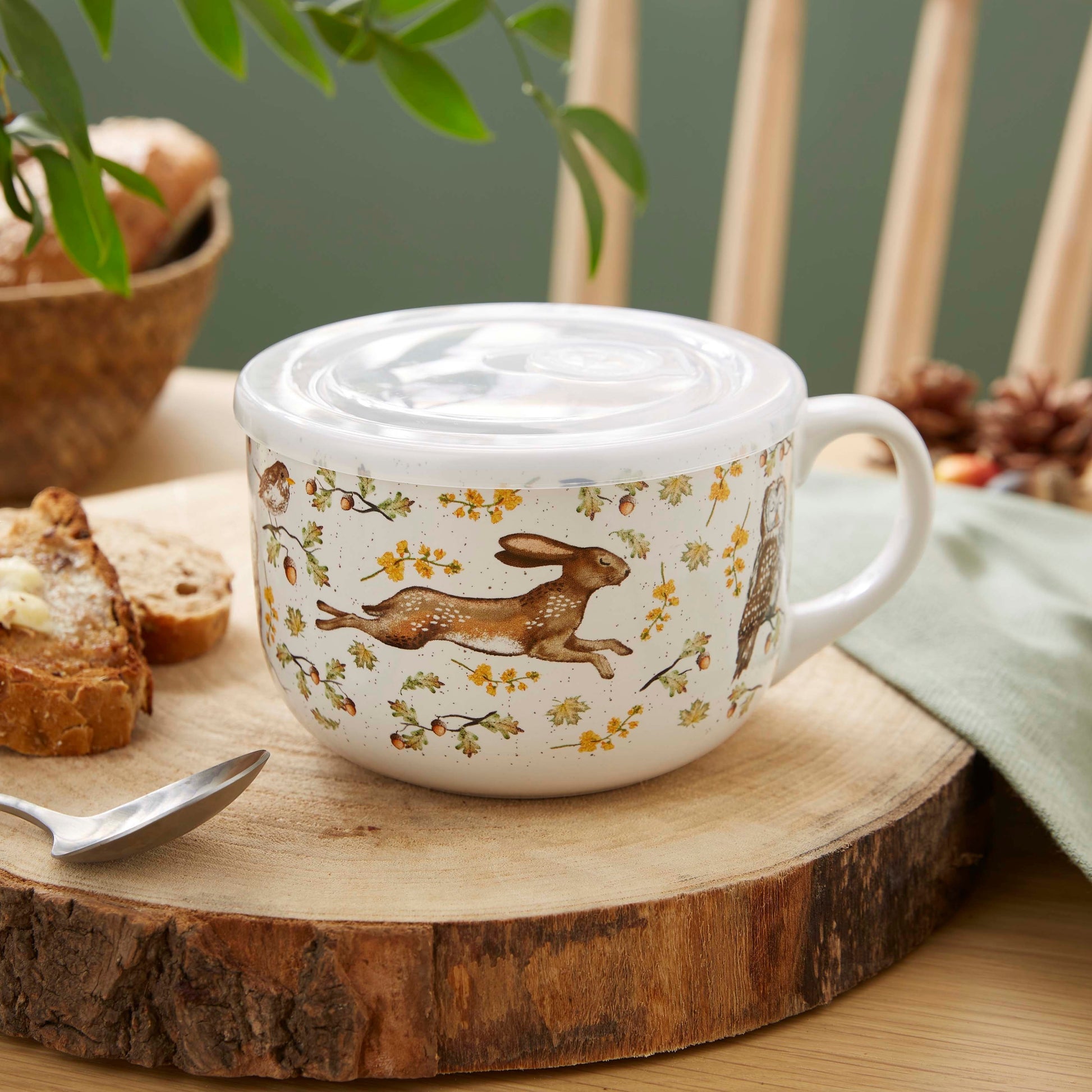 Cartco Cooksmart Forest Fable ceramic soup mug with woodland animal illustrations and a white plastic lid
