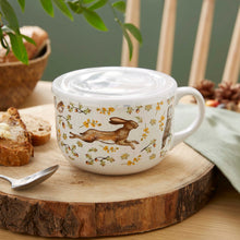 Cartco Cooksmart Forest Fable ceramic soup mug with woodland animal illustrations and a white plastic lid