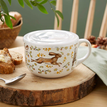Cartco Cooksmart Forest Fable ceramic soup mug with woodland animal illustrations and a white plastic lid