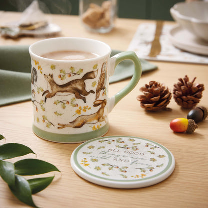 Cartco Cooksmart Forest Fable ceramic mug and coaster set with woodland animal illustrations and sage green accents.