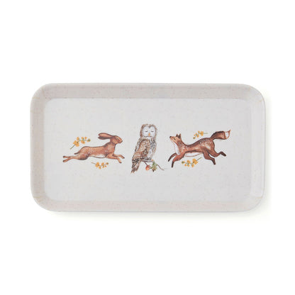 Cartco Cooksmart Forest Fable rectangular tray with hare, owl, and fox illustrations on a speckled cream background.